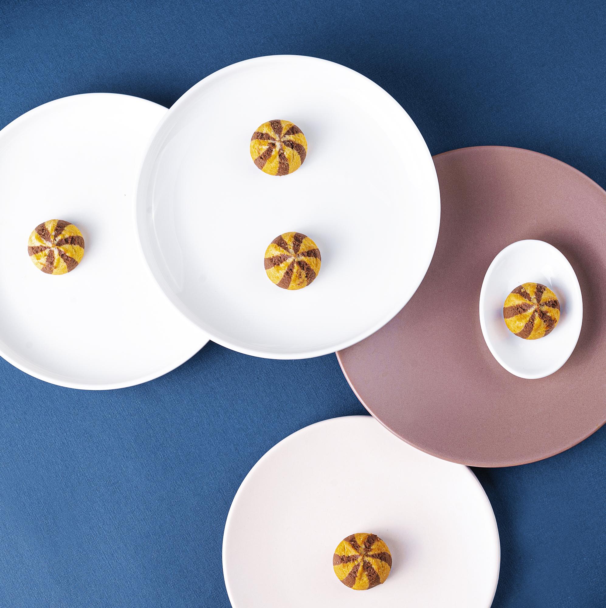 Open kitchen with plated dishes on a paper-like tray